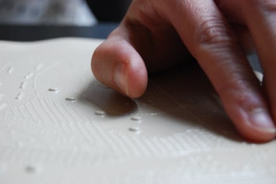 Hands proofing tactile graphic