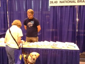 Photo of Tim Turnbull chattin with a customer at the ACB Convention in Columbus.