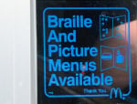 Sign that says Braille and Picture Menus Available