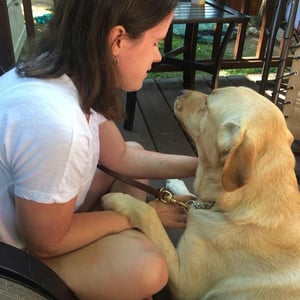 Proofreader Carey Scouler and her guide dog Hayden