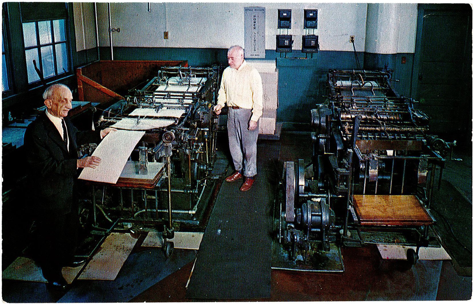 An older Iernardi stands with an NBP staffer, checking braille pages that have just come off the press some time in the 1950s. 