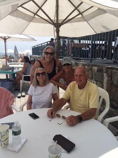 All four of Francis and Laura Ierardi's adult grandchildren on a sunny day at an outdoor restaurant.