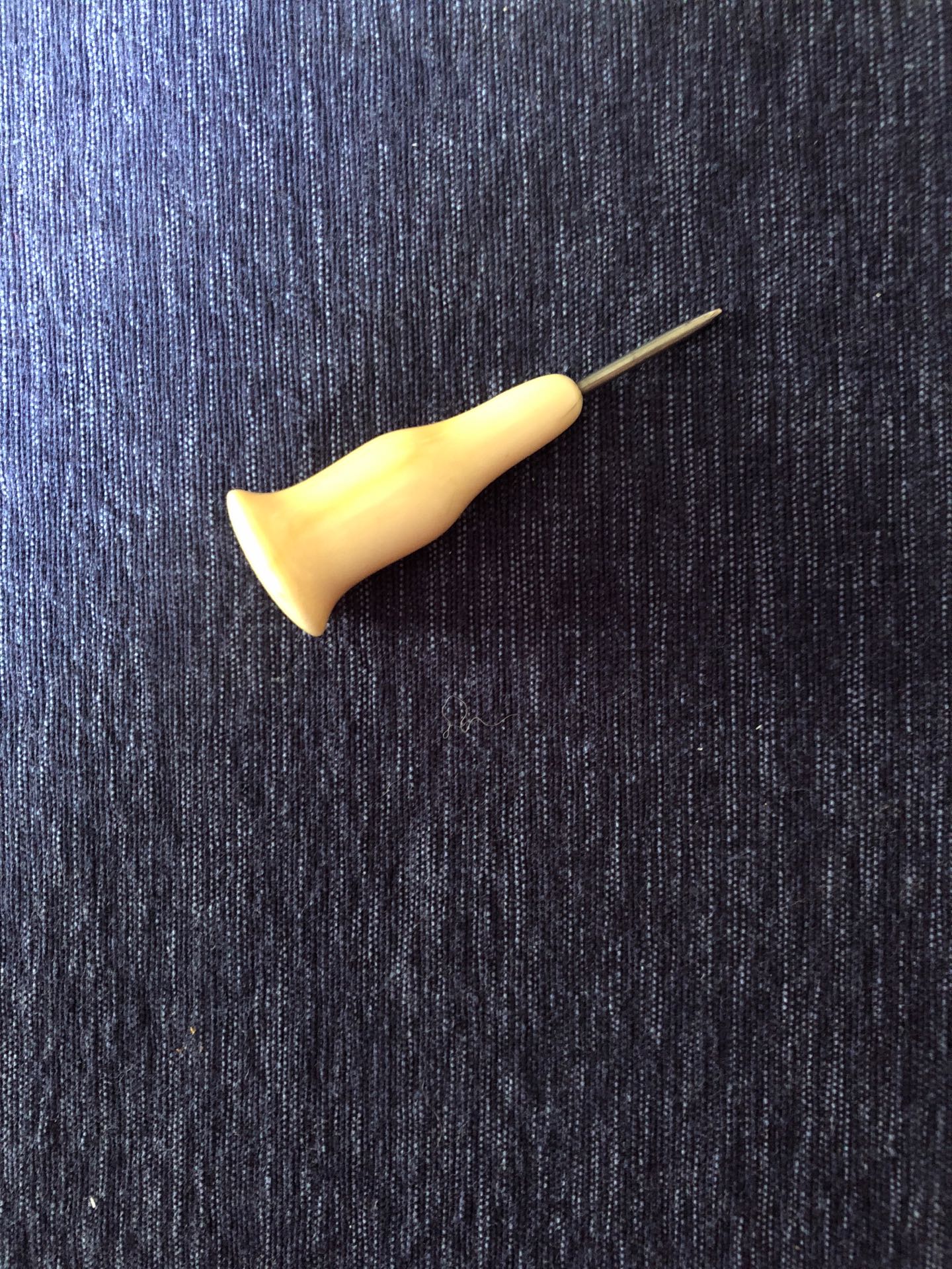 An ivory-handled stylus used by the blind jazz musician, George Shearing, at the school for the blind in England in the 1920s.
